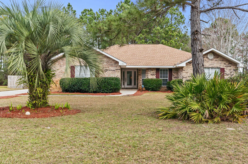 186 Shipwreck Road Santa Rosa Beach, FL 32459 - Photo 2 of 37 a view of a house with a yard and plants