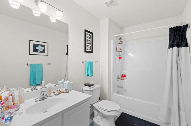 186 Shipwreck Road Santa Rosa Beach, FL 32459 - Photo 23 of 37 a bathroom with a sink mirror vanity and toilet