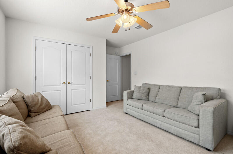 186 Shipwreck Road Santa Rosa Beach, FL 32459 - Photo 24 of 37 a living room with furniture and a ceiling fan
