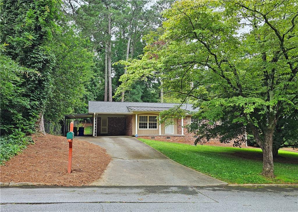 front view of a house with a garden