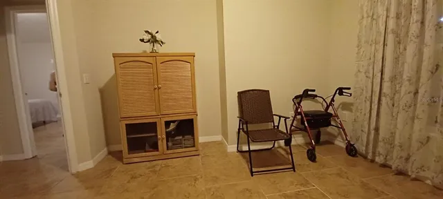 a view of a livingroom with furniture and a ceiling fan