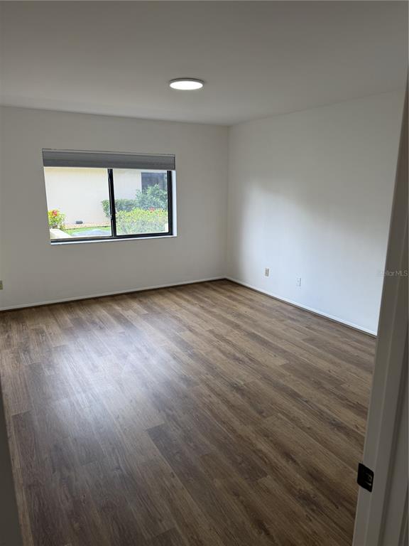 2004 Longpointe Circle Venice, FL 34293 - Photo 54 of 54 an empty room with wooden floor and windows