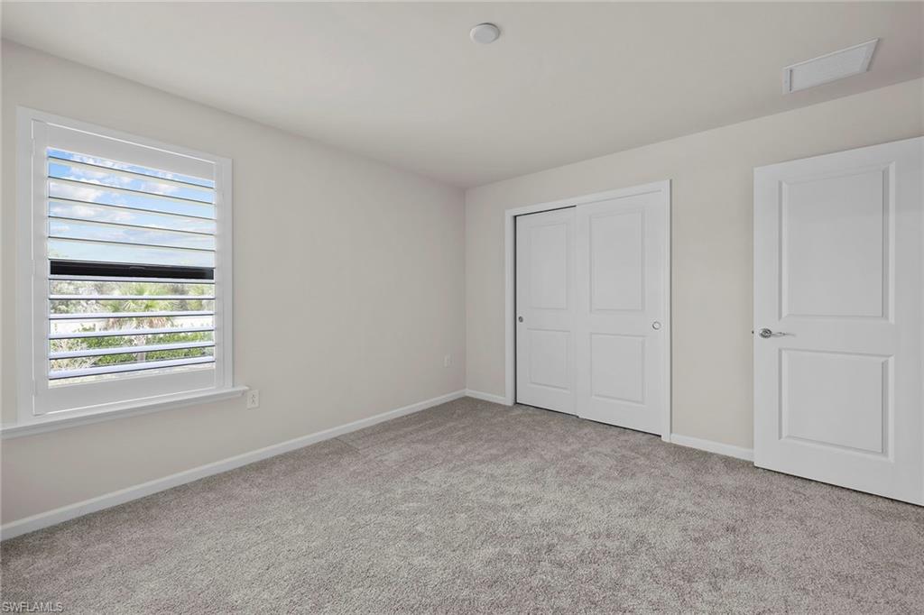 2236 Yellowfin Circle Naples, FL 34114 - Photo 22 of 39 a view of an empty room with a window