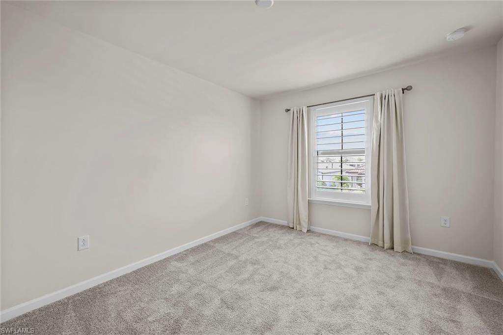 2236 Yellowfin Circle Naples, FL 34114 - Photo 23 of 39 an empty room with windows