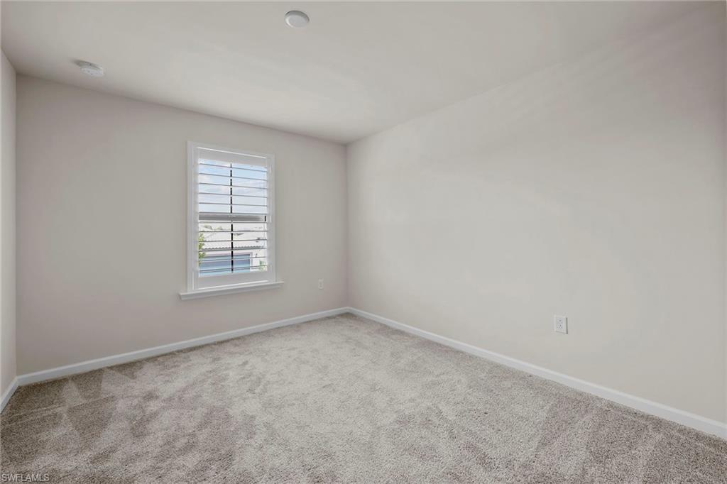 2236 Yellowfin Circle Naples, FL 34114 - Photo 24 of 39 an empty room with windows