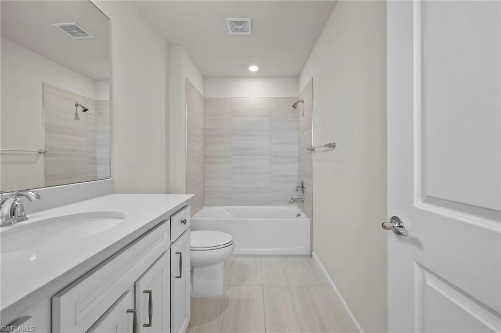 2236 Yellowfin Circle Naples, FL 34114 - Photo 25 of 39 a bathroom with a sink a toilet and shower