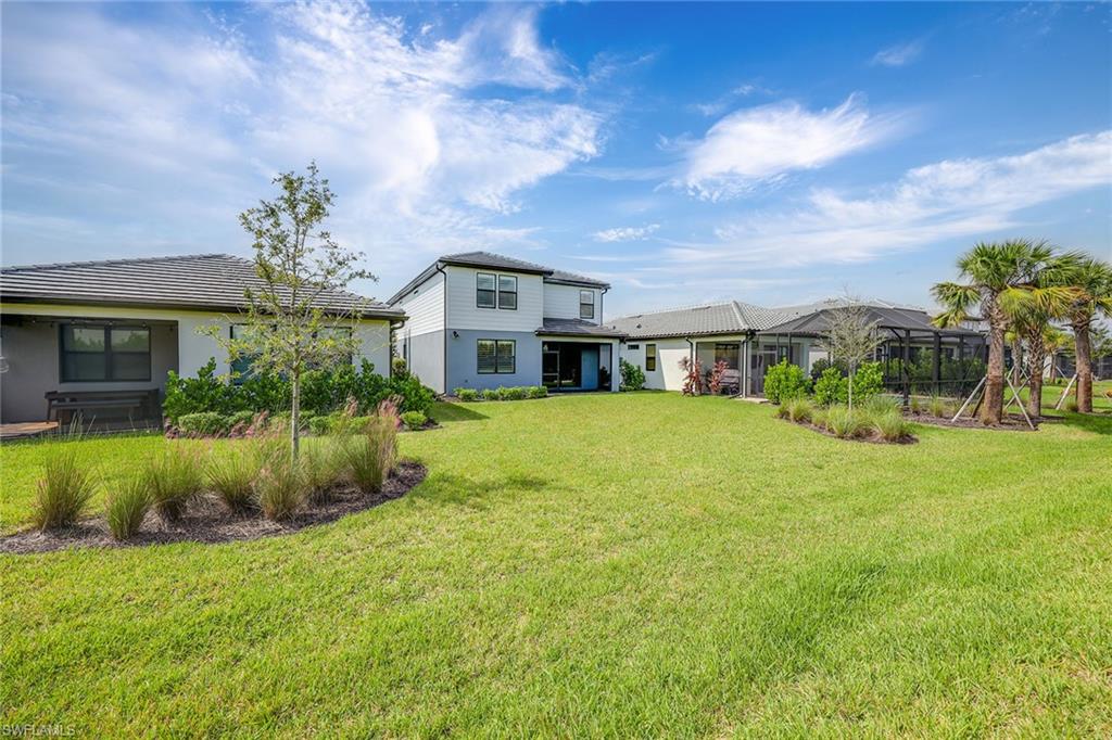 2236 Yellowfin Circle Naples, FL 34114 - Photo 29 of 39 a front view of a house with a yard