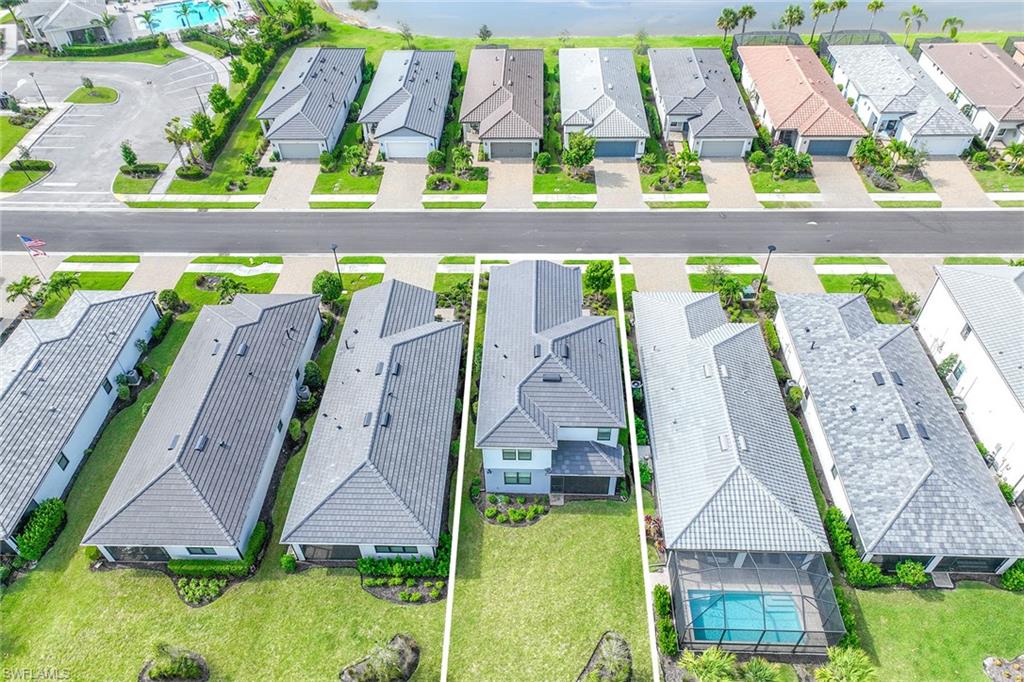 2236 Yellowfin Circle Naples, FL 34114 - Photo 32 of 39 a view of swimming pool with a outdoor seating