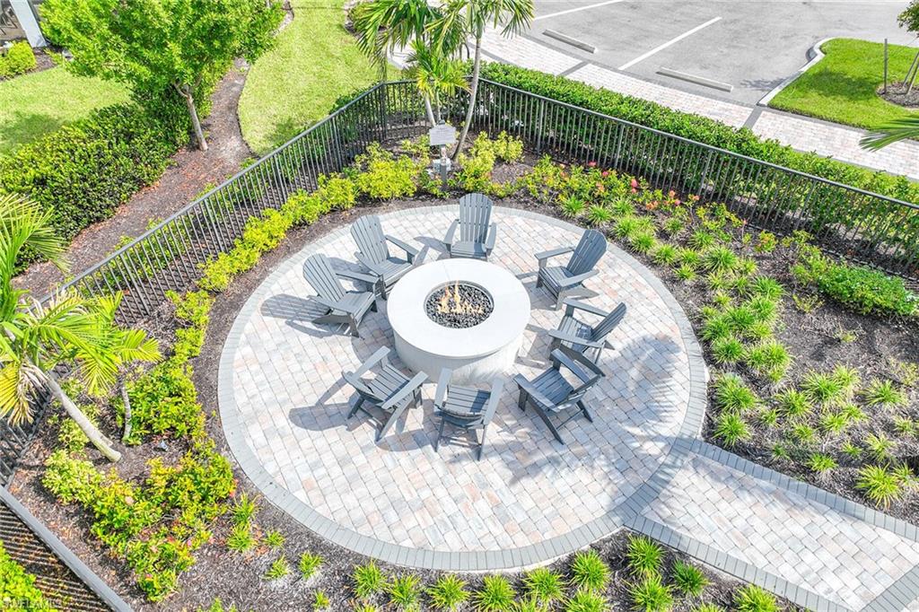 2236 Yellowfin Circle Naples, FL 34114 - Photo 36 of 39 a view of a swimming pool with a yard