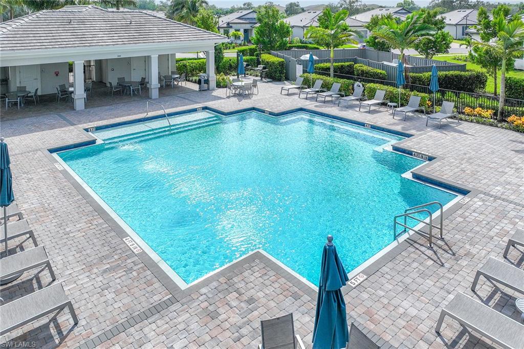 2236 Yellowfin Circle Naples, FL 34114 - Photo 37 of 39 a view of a house with pool porch and chairs