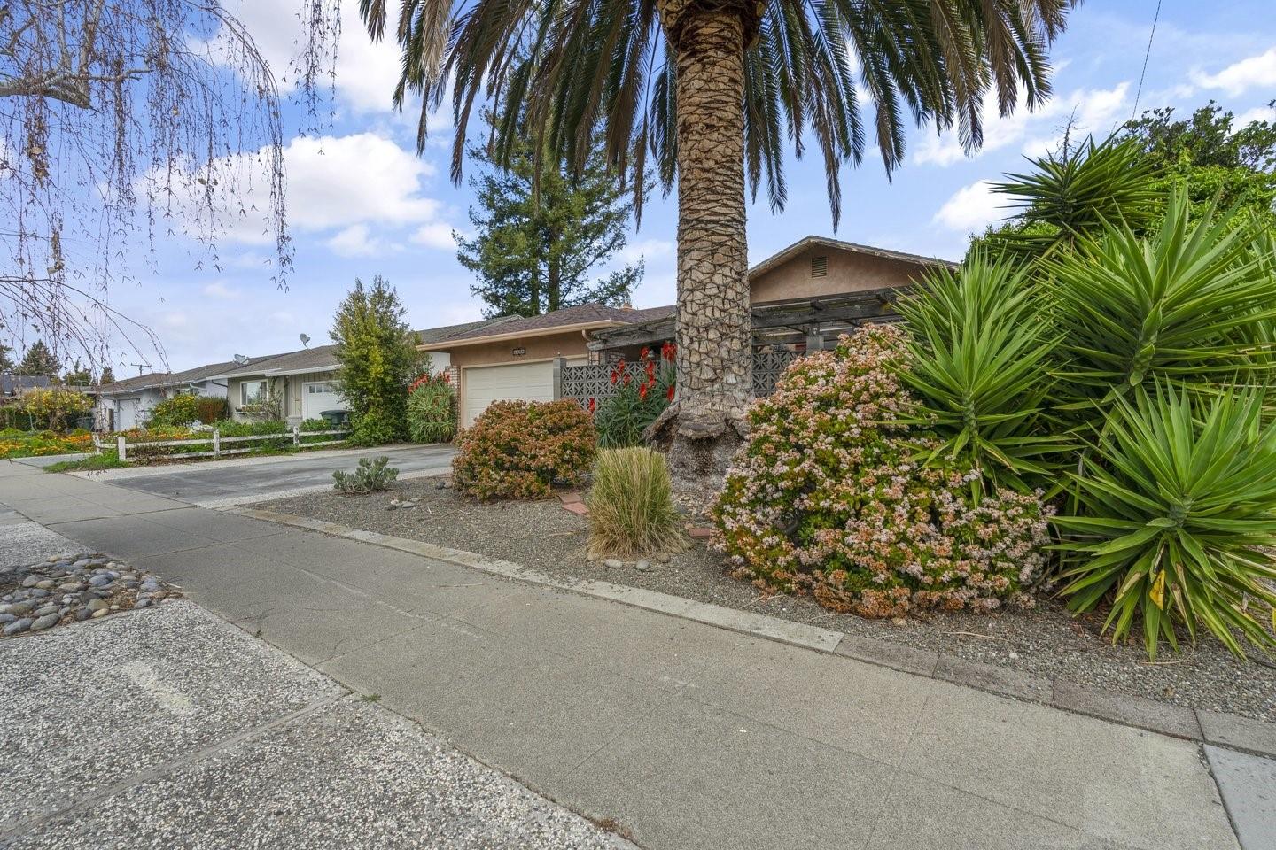1374 Primrose Way Cupertino, CA 95014 - Photo 3 of 35 a couple of palm trees in front of a building