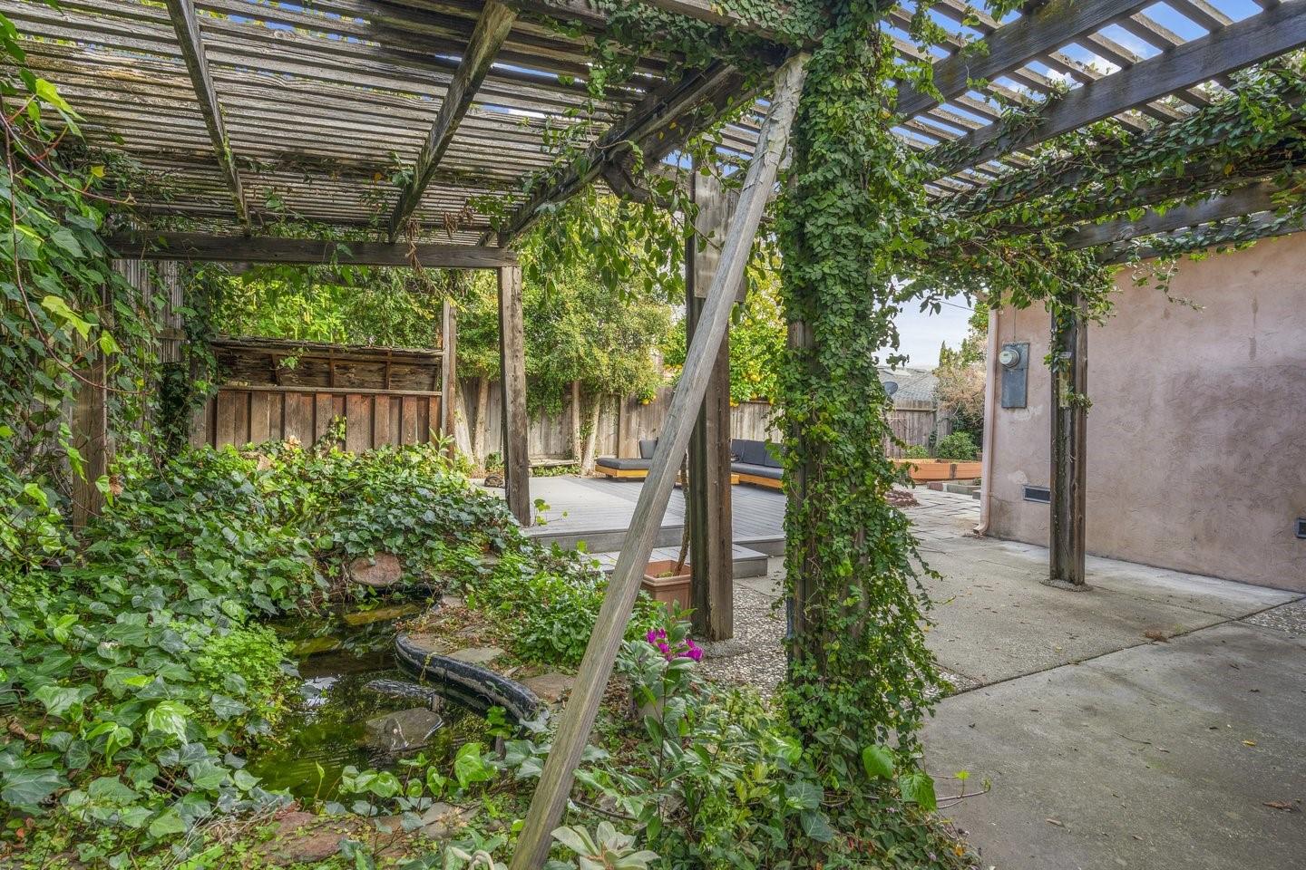 1374 Primrose Way Cupertino, CA 95014 - Photo 34 of 35 a backyard of a house with plants and outdoor seating