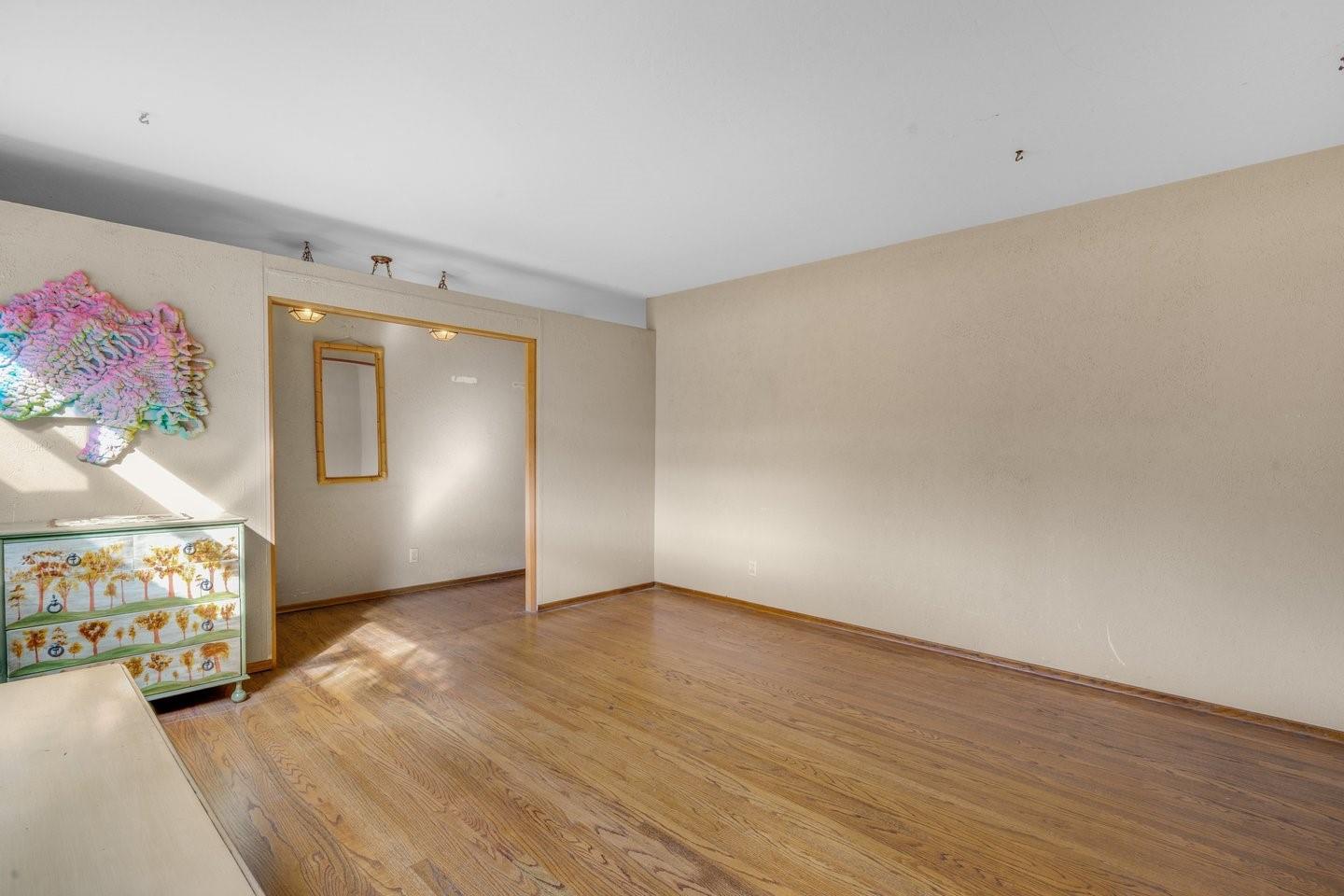 1374 Primrose Way Cupertino, CA 95014 - Photo 8 of 35 a view of an empty room with wooden floor and windows