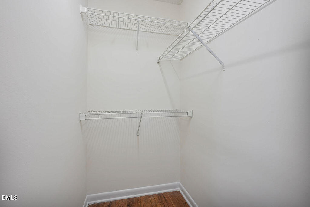 1411 Collegiate Circle, Unit 302 Raleigh, NC 27606 - Photo 16 of 43 a view of a room with racks on the wall