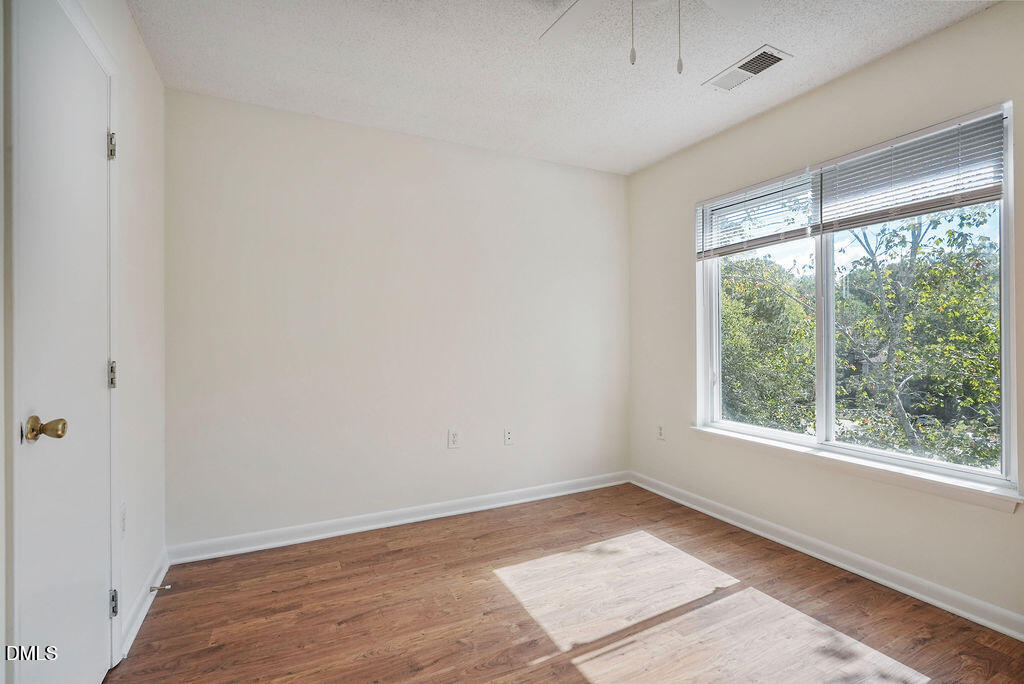 1411 Collegiate Circle, Unit 302 Raleigh, NC 27606 - Photo 21 of 43 a view of an empty room and window