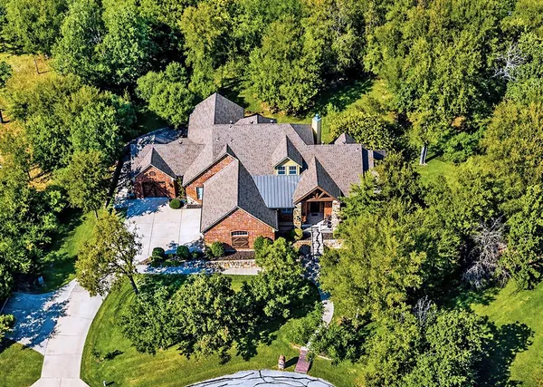 a living room with furniture fireplace and dining table