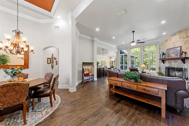 a living room with furniture fireplace and flat screen tv