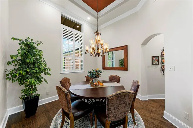 a view of a dining area with furniture window and wooden floor