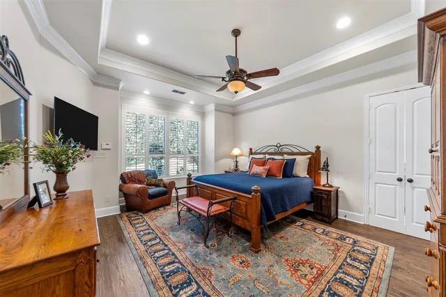 a bathroom with a granite countertop sink a large mirror and a chandelier