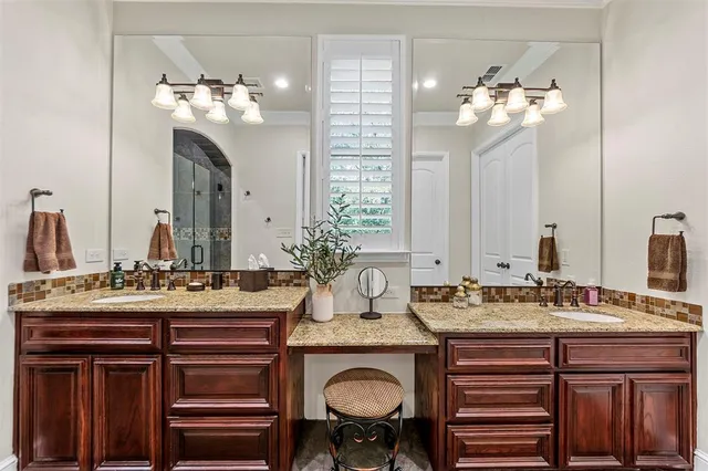 a bathroom with a double vanity sink and a mirror