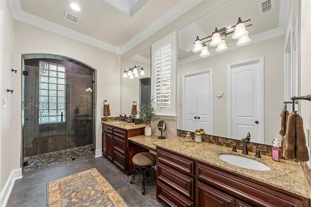 a bedroom with a bed and a potted plant