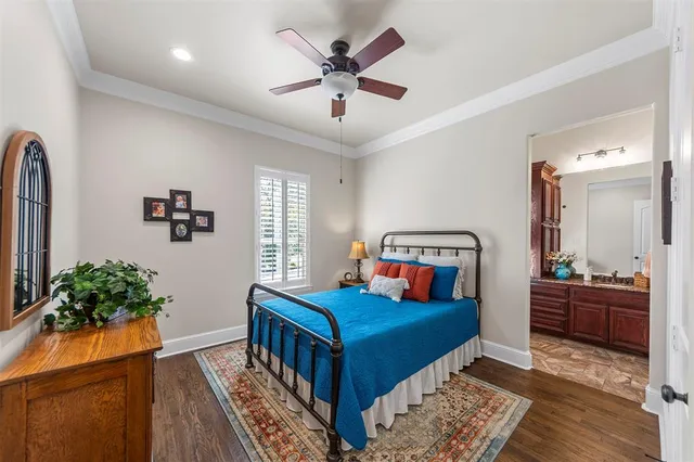 a bathroom with a granite countertop sink a mirror and a shower