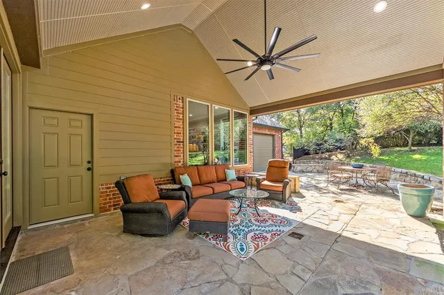 a outdoor space with patio the couches and a dining table with garden view