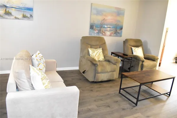 a living room with furniture and a window