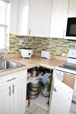a kitchen with a stove and a sink