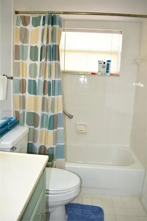 a bathroom with a sink a toilet and a bathtub