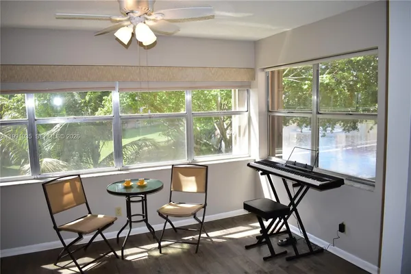 a view of a dining room with furniture window and outside view