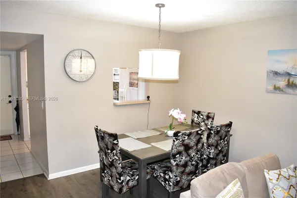 a outdoor dining area with furniture and a chandelier