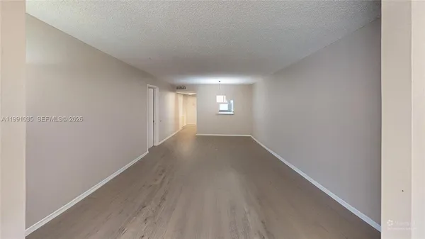 a view of an empty room and window