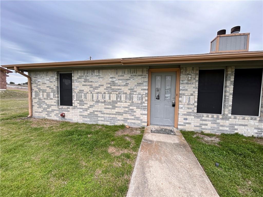 A classic brick exterior offers timeless curb appeal with a welcoming front entrance.