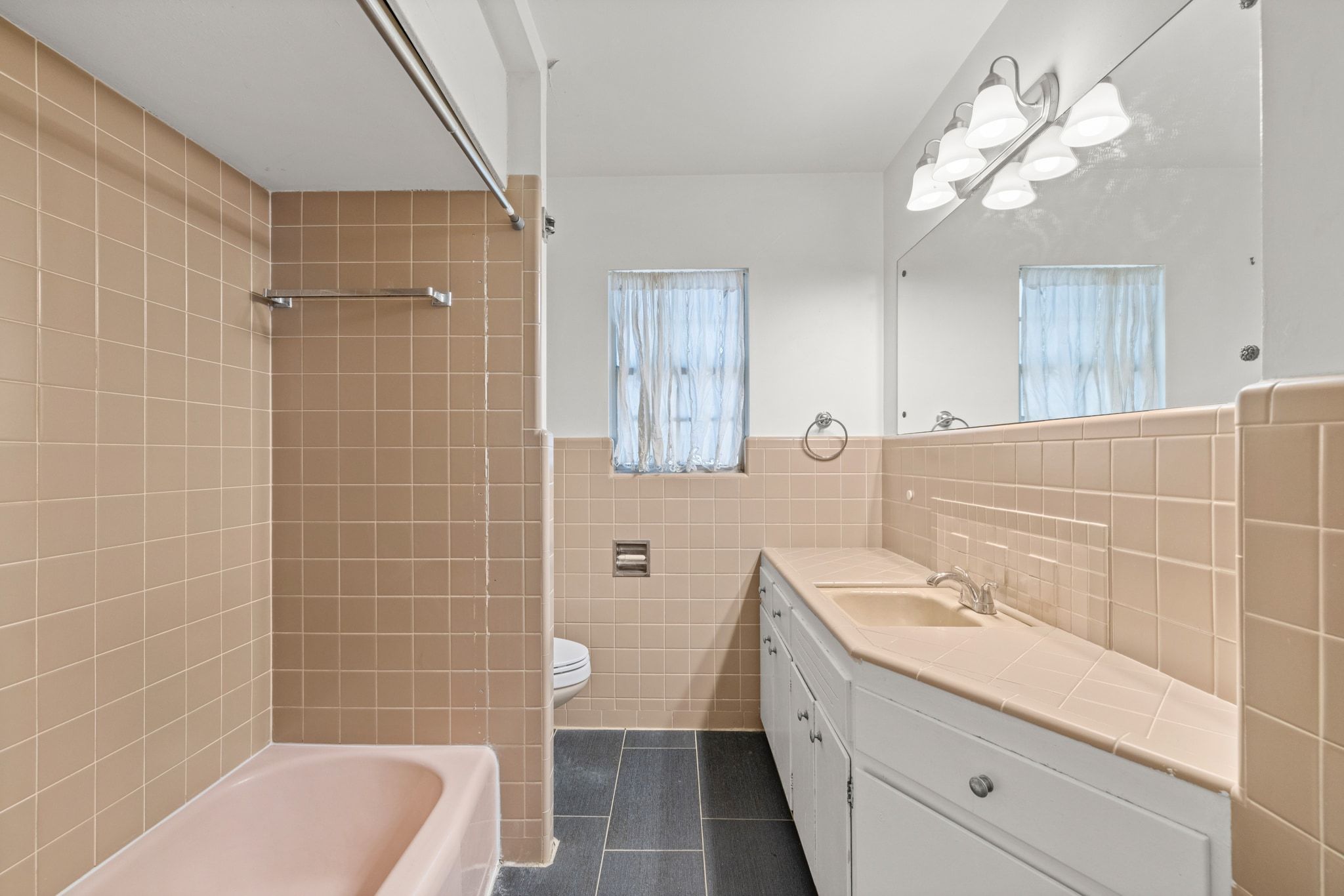 2326 Hartford Road, Unit 1/2 Austin, TX 78703 - Photo 22 of 28 a bathroom with a sink a toilet a mirror and shower
