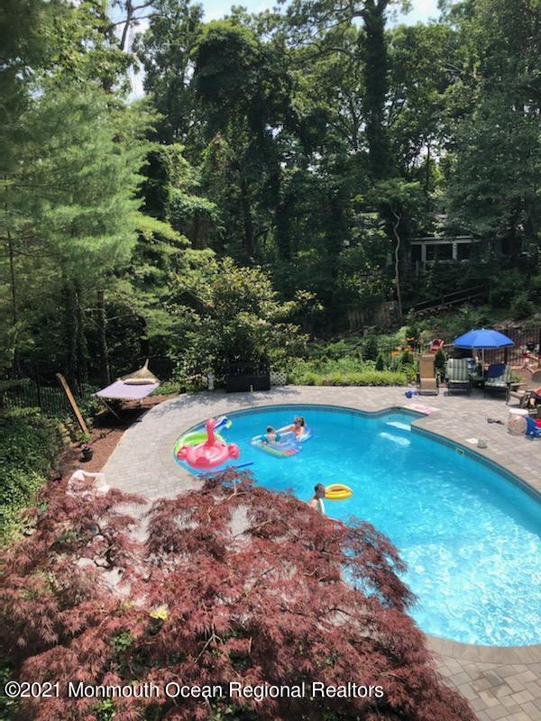625 Oceanview Road Brielle, NJ 08730 - Photo 22 of 47 Pool in Wooded Backyard