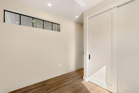 a view of staircase with wooden floor