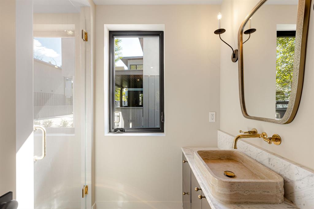 4414 Banister Lane, Unit 2 Austin, TX 78745 - Photo 16 of 28 a bathroom with a sink and a mirror
