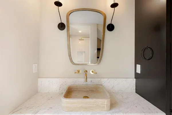a bathroom with a sink and a mirror