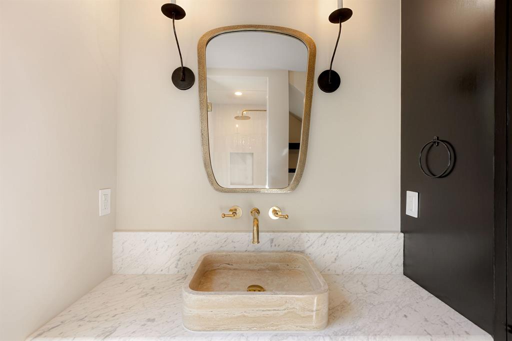 4414 Banister Lane, Unit 2 Austin, TX 78745 - Photo 17 of 28 a bathroom with a sink and a mirror