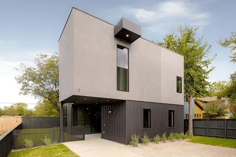 a front view of a house with a garage