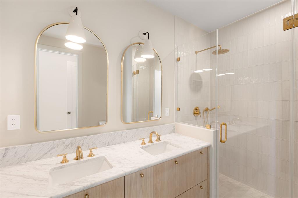 4414 Banister Lane, Unit 2 Austin, TX 78745 - Photo 22 of 28 a bathroom with a sink double vanity and a mirror
