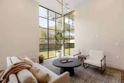 a living room with furniture and a table