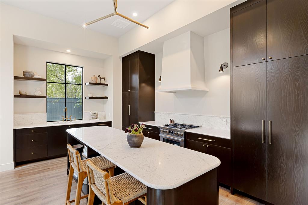 4414 Banister Lane, Unit 2 Austin, TX 78745 - Photo 10 of 28 a kitchen with a table chairs and refrigerator