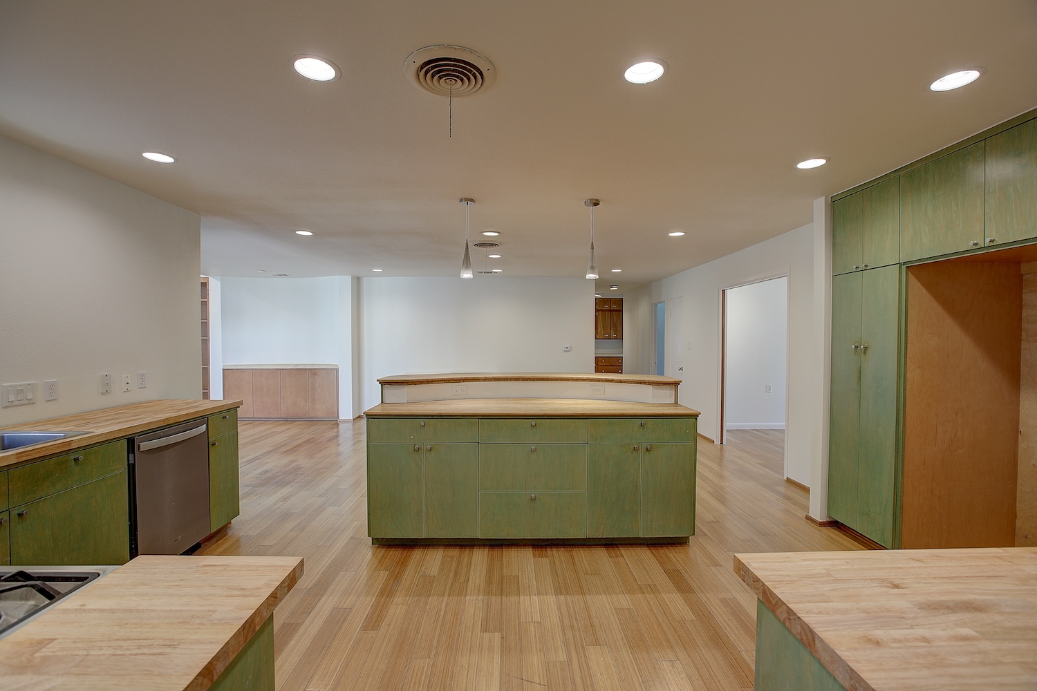 1607 South Elm Street Georgetown, TX 78626 - Photo 17 of 40 a view of kitchen with cabinets and wooden floor