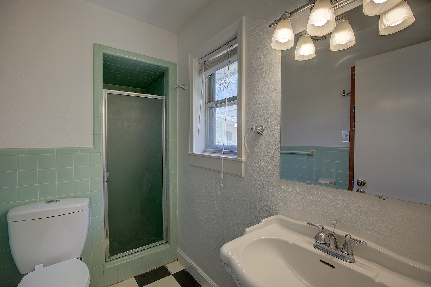 1607 South Elm Street Georgetown, TX 78626 - Photo 19 of 40 a bathroom with a toilet sink and mirror