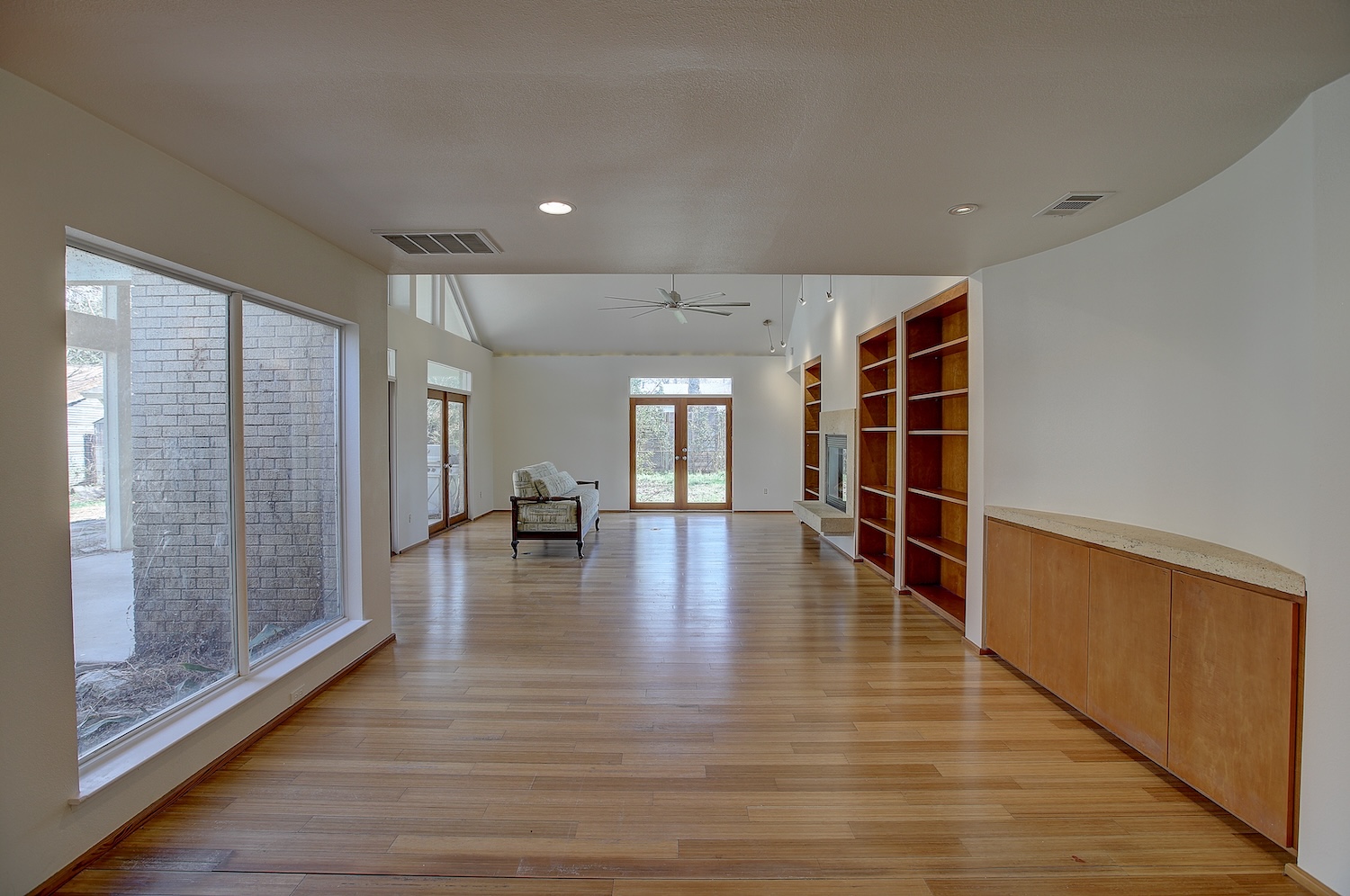 1607 South Elm Street Georgetown, TX 78626 - Photo 20 of 40 a view of empty room with wooden floor and floor to ceiling window