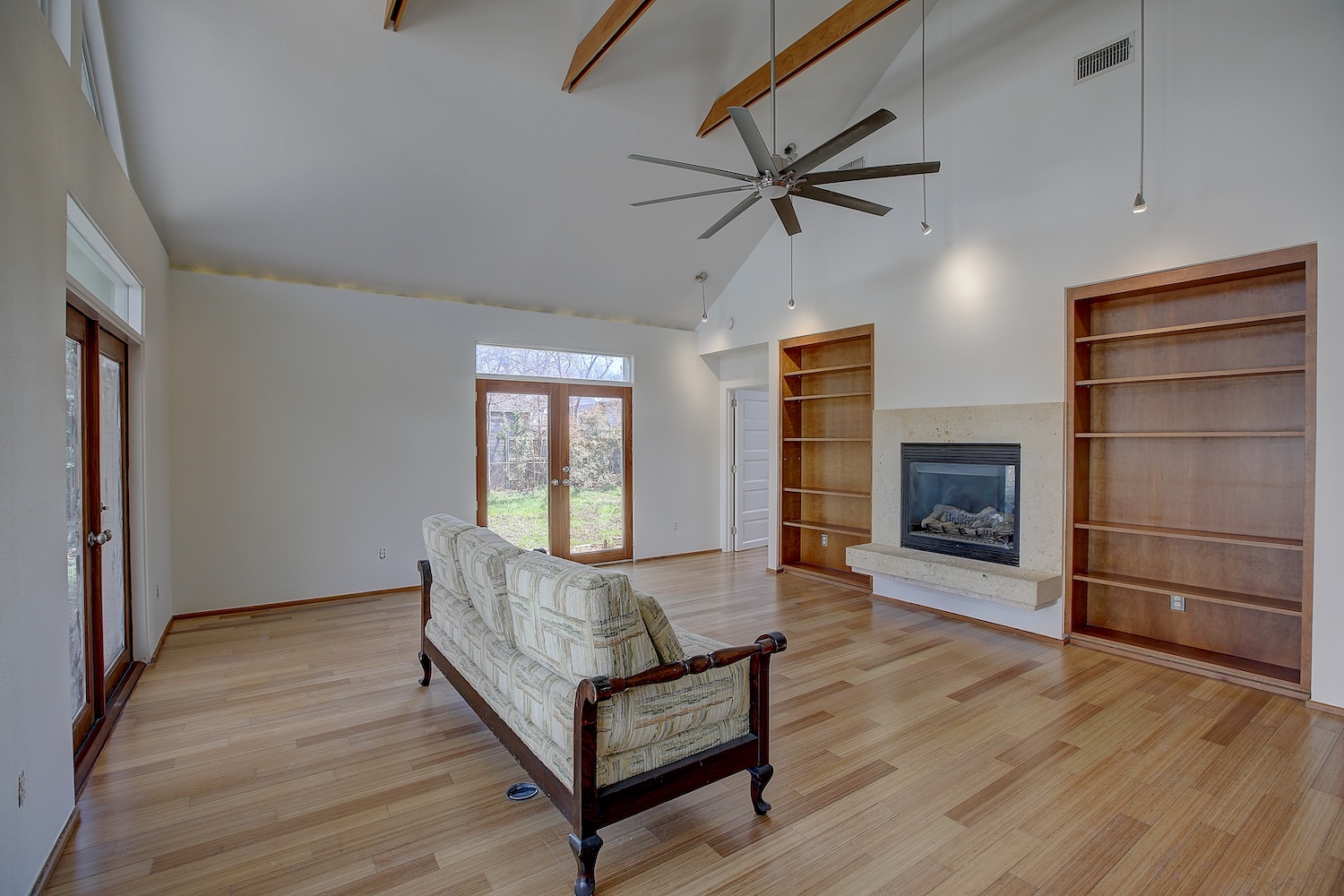 1607 South Elm Street Georgetown, TX 78626 - Photo 23 of 40 a living room with a bed furniture and a fireplace