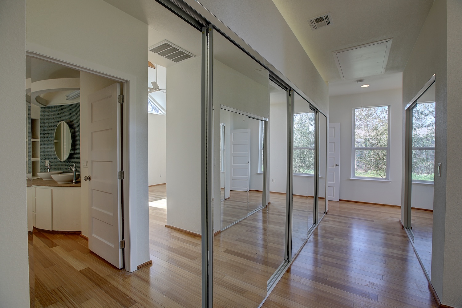1607 South Elm Street Georgetown, TX 78626 - Photo 24 of 40 a view of a hallway with wooden floor and glass door