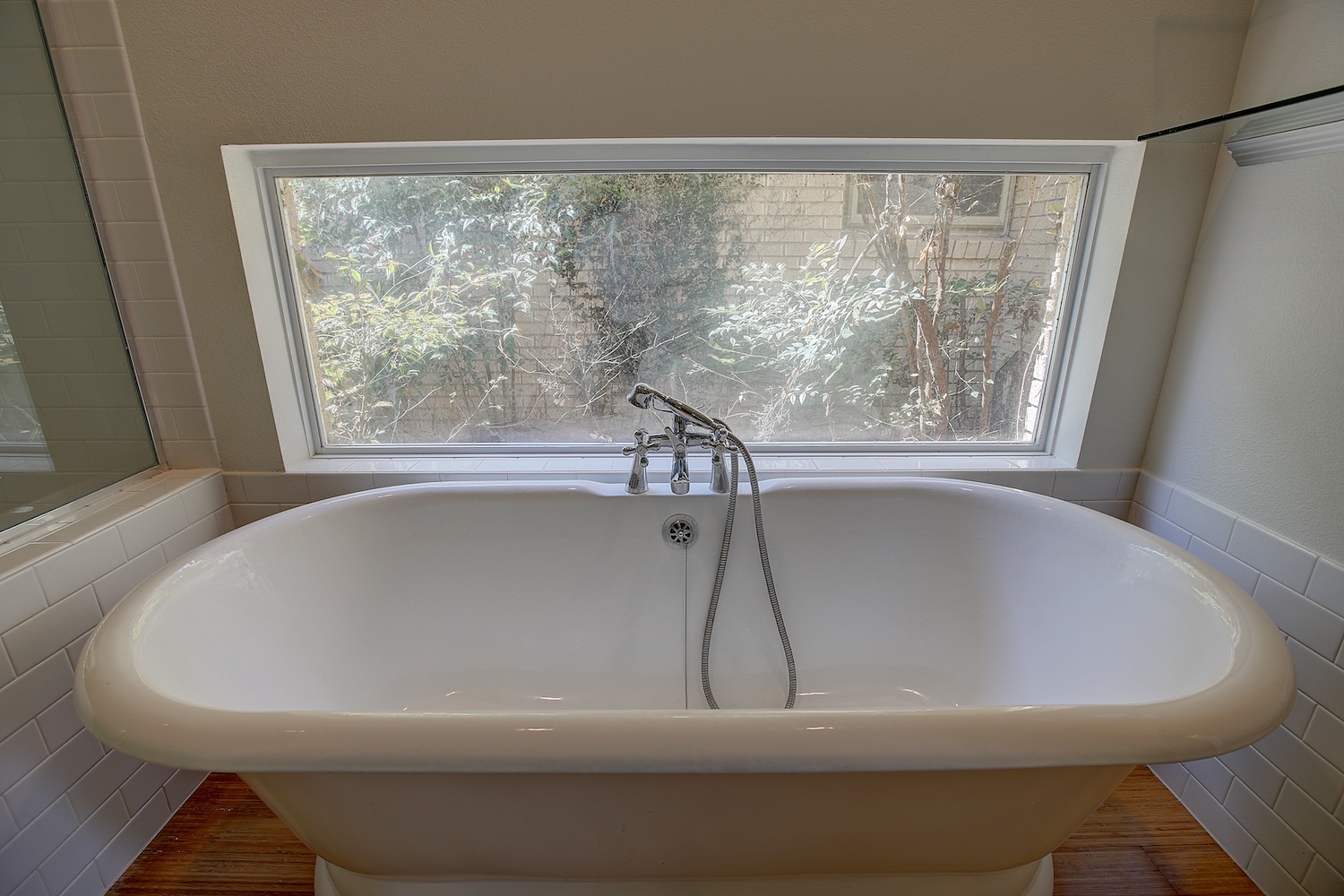 1607 South Elm Street Georgetown, TX 78626 - Photo 26 of 40 a white bath tub sitting in a bathroom